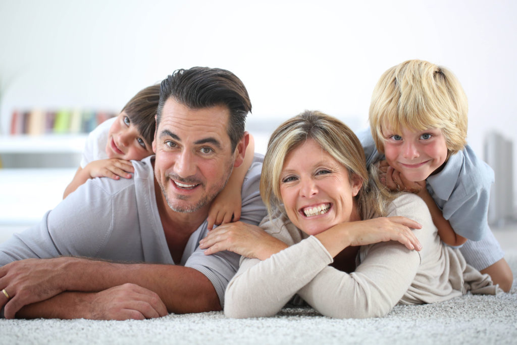 Happy-Family-on-Carpet-shutterstock_218825515-1024x683-1024x683